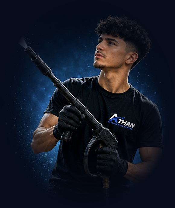 Athan technician pressure washing